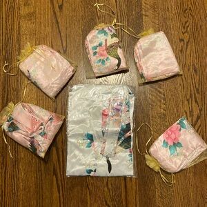 One white and five pink silk like robes